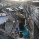 A child climbs through the Mangueira favela located less than a mile from the iconic Maracanã stadium. (Photo: Getty)